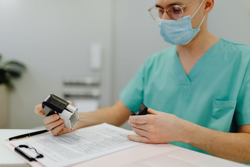 Medical Personnel Reading A Paper