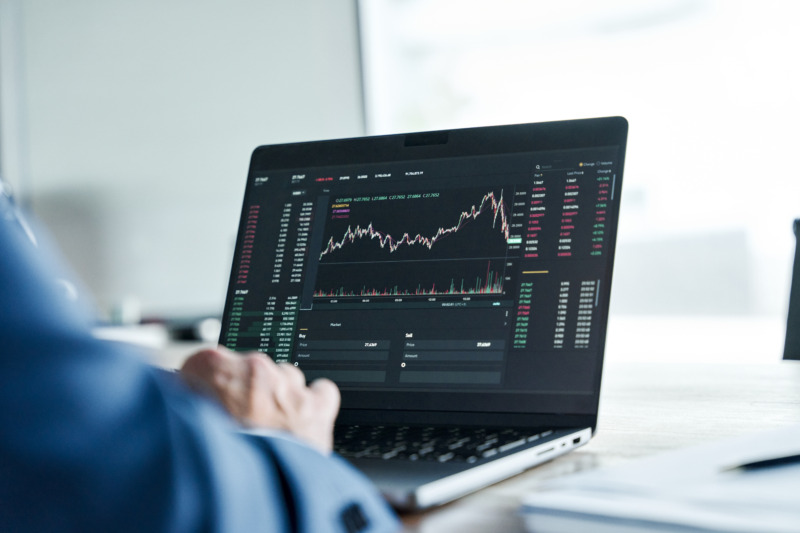 Close-up of a laptop screen showing the financial stock trade stock market graph