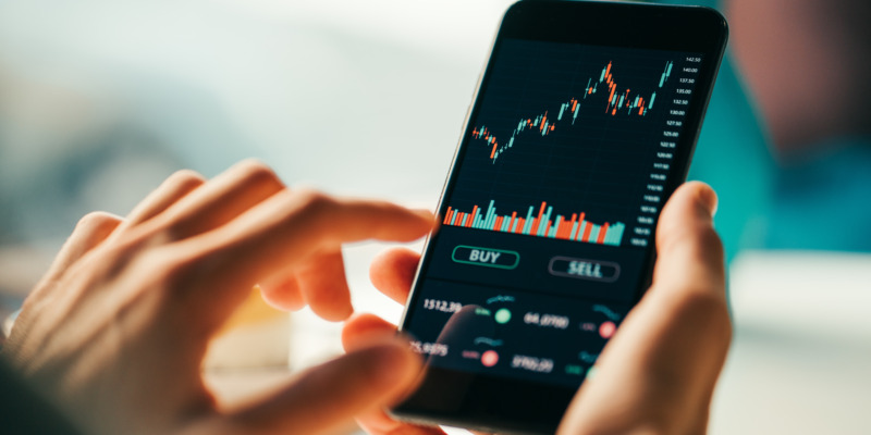 Close-up of a phone screen showing the financial stock trade stock graph from a mobile phone investing application