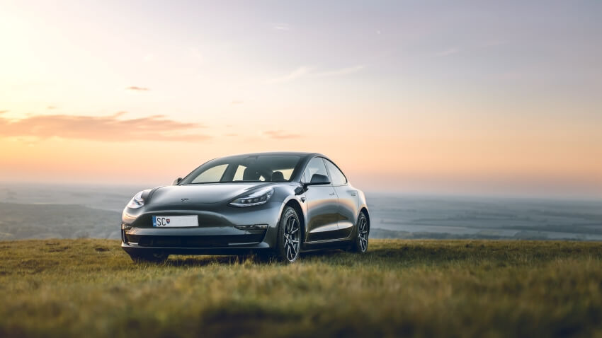 Grey Car on a Grass Field