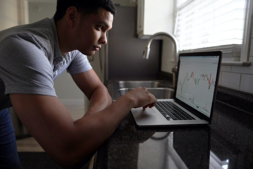 Man Checking Stocks Market Graph