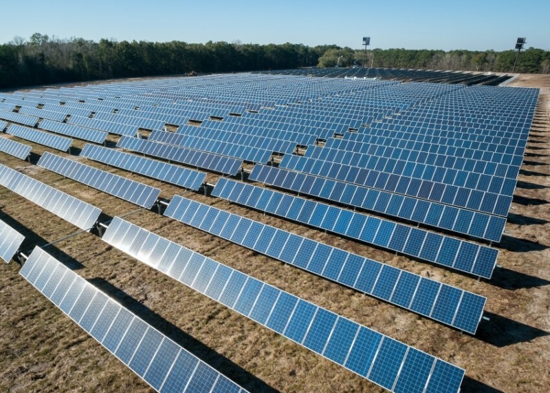 Rows of Solar Panels in an Open Space