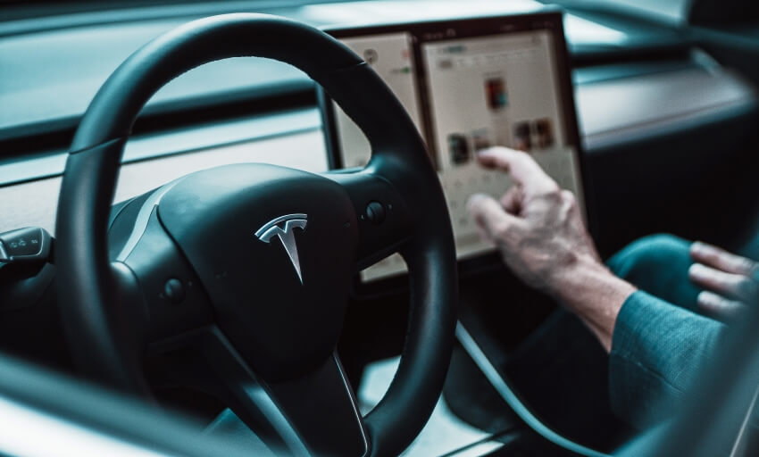 Interior of a Car, Steering Wheel, and an Electronic Device