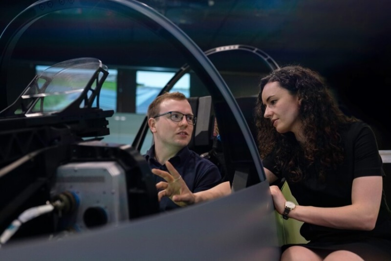 Woman Talking to a Man in  a Test Drive