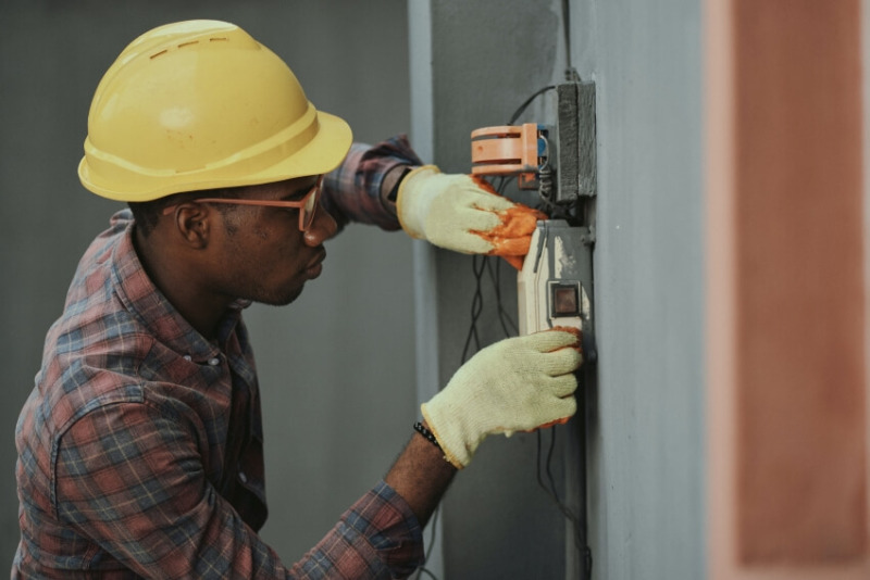 Man Checking on Electricity Cords