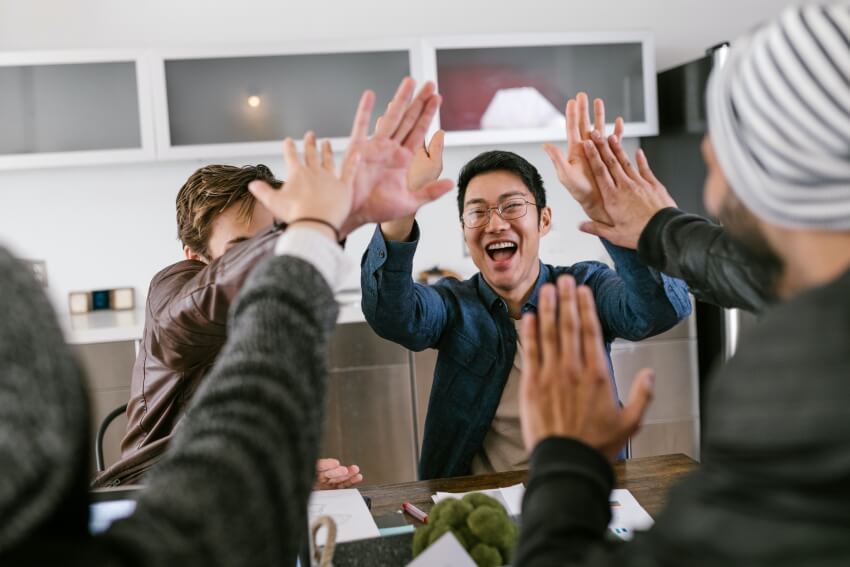 Group Having a Fun High Five