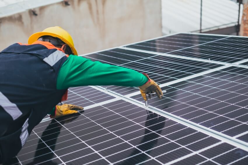 Man Installing a Set of Solar Panels