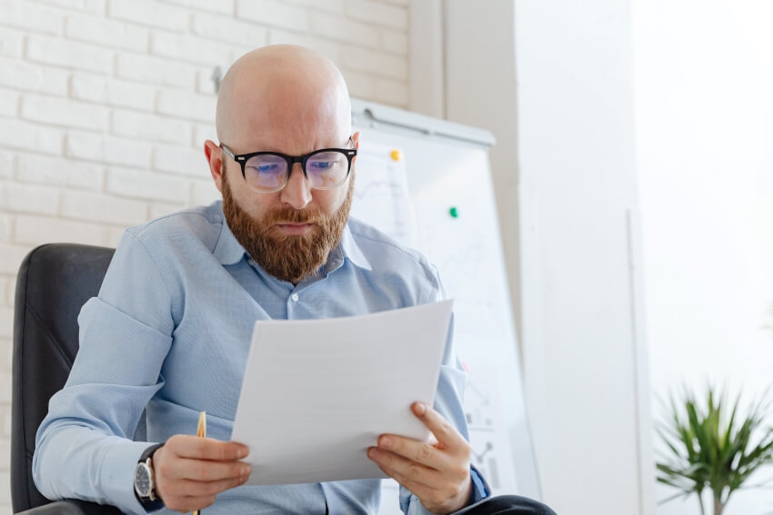 Man Reading a Contract