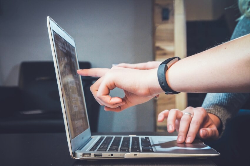 Two Fingers Pointing on a Laptop