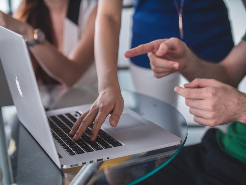 Hand Pointing on a Laptop Screen Monitor