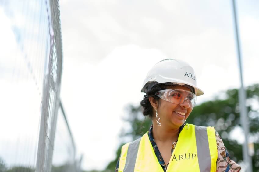 Smiling Woman with a White Hard Hat