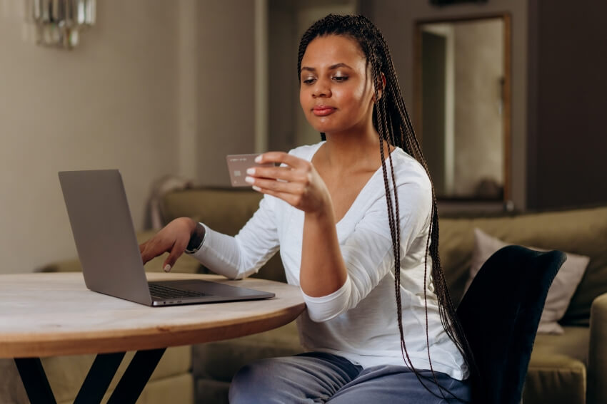 Woman Holding a Credit Card