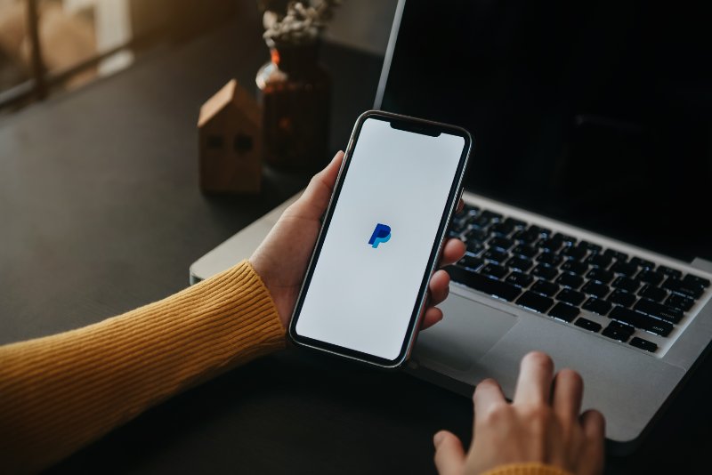 Woman using PayPal on Phone