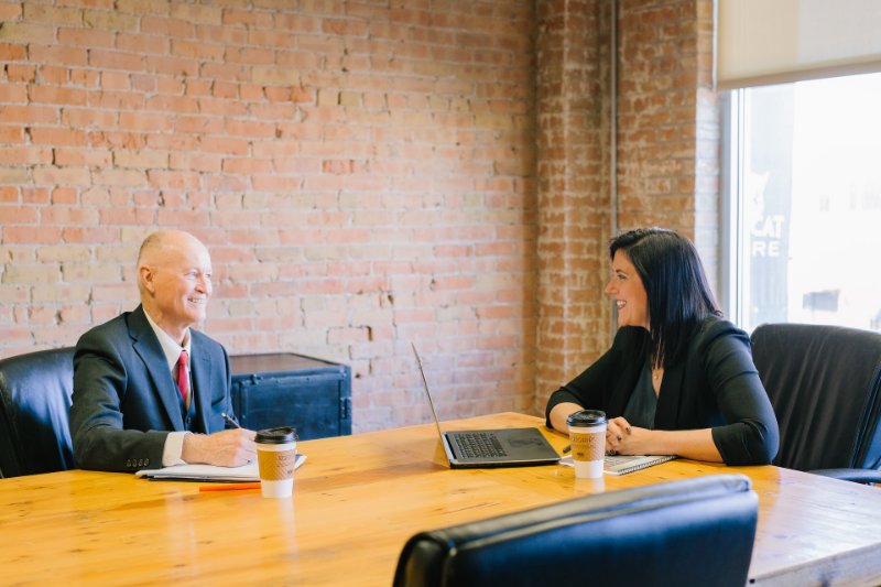 Businessman and Woman on a Discussion