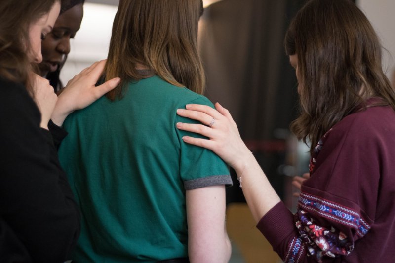 Group Comforting a Girl