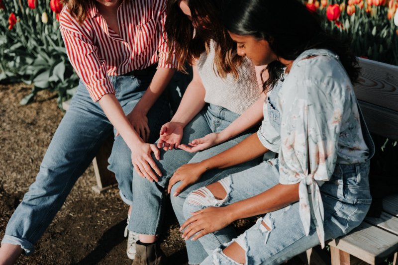 Tow Girls Comforting a Girl