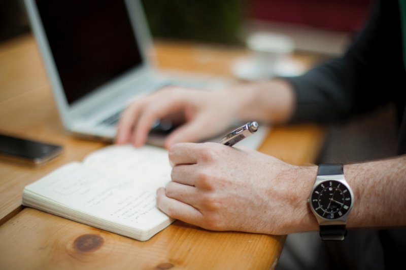 Writing on a Notebook