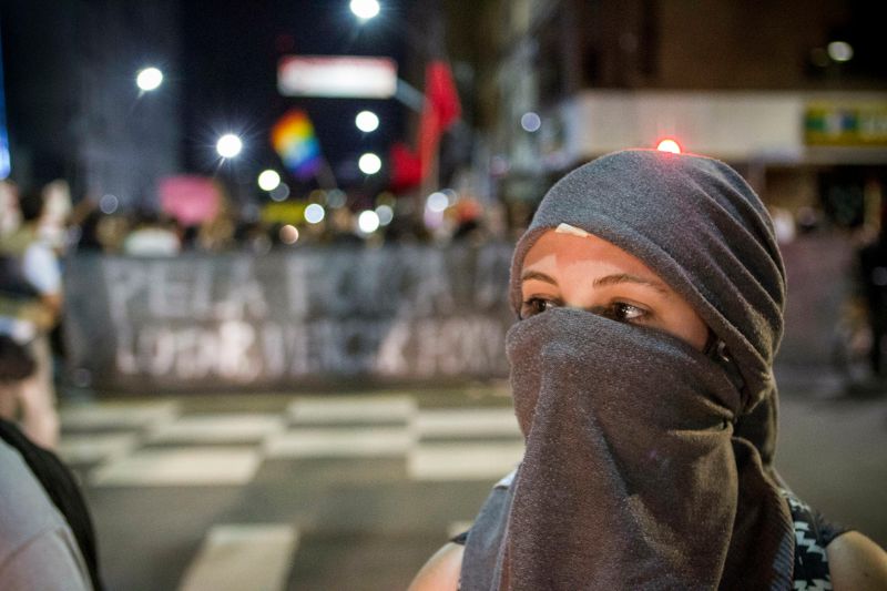 Woman Protestor in Mask and Headgarb