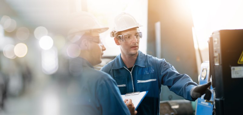 Man explaining work to team member