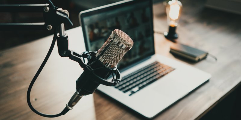 Microphone, laptop and on air lamp on the table, close-up