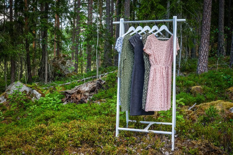 Clothes hanger with dresses in the woods