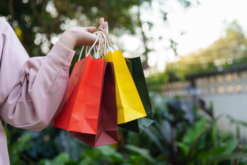 Woman holding a colorful shopping bags