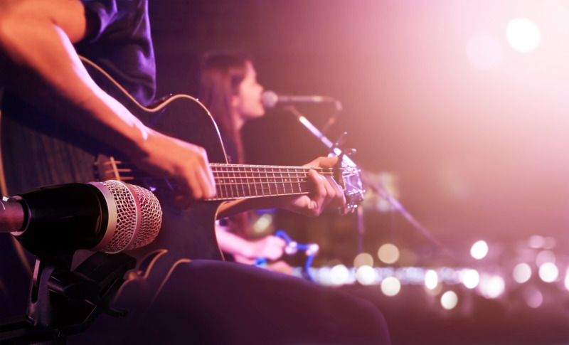 Man playing guitar on stage