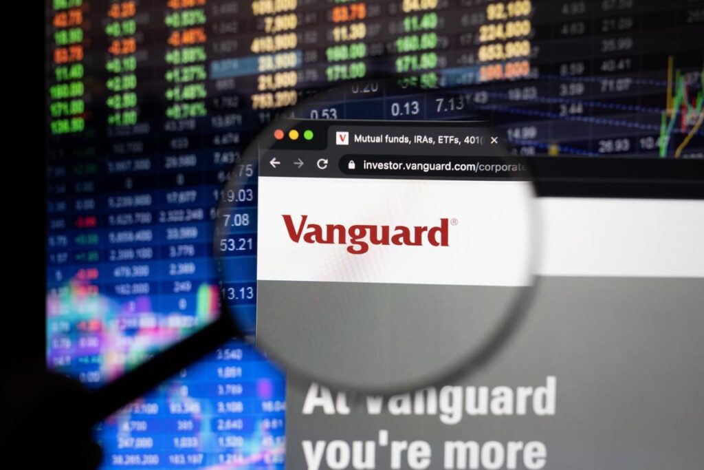 Vanguard investment website with financial data on screen